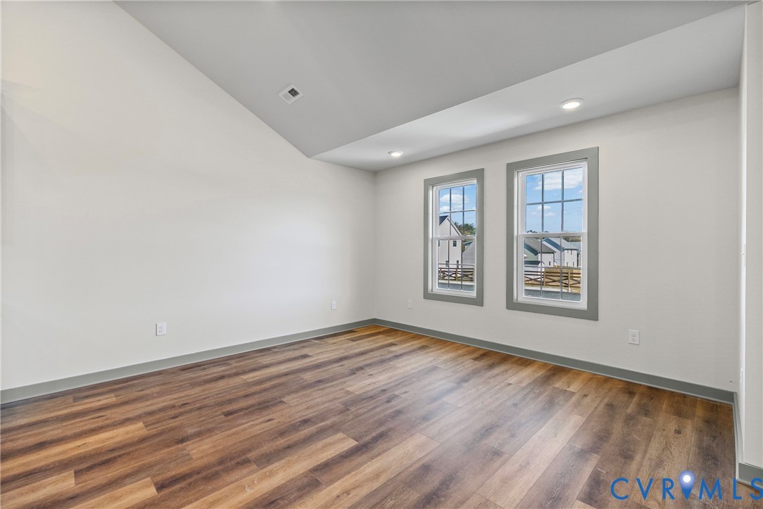 203 Zion Drive Farmville, VA 23901 - Photo 8 of 20 wooden floor in an empty room with a window