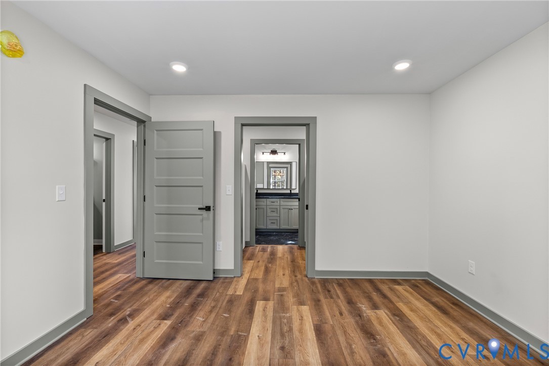 203 Zion Drive Farmville, VA 23901 - Photo 9 of 20 wooden floor in an empty room with a window