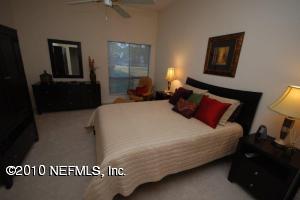 14 Cove Road Ponte Vedra Beach, FL 32082 - Photo 6 of 18 a bedroom with a bed and a night stand