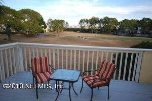 14 Cove Road Ponte Vedra Beach, FL 32082 - Photo 8 of 18 a view of a chair and table on the terrace