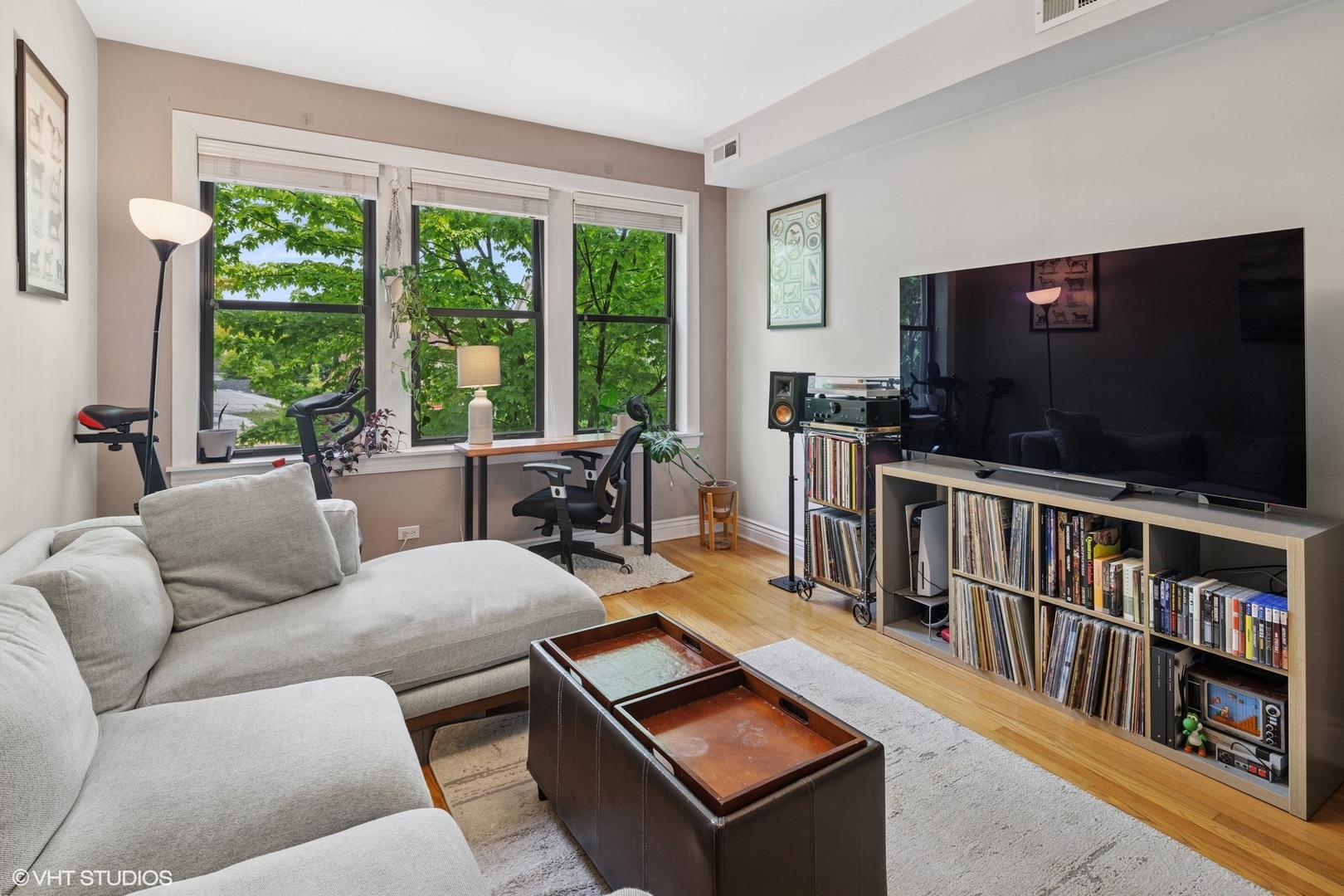 2709 West Altgeld Street, Unit 2 Chicago, IL 60647 - Photo 2 of 13 a living room with furniture and a flat screen tv