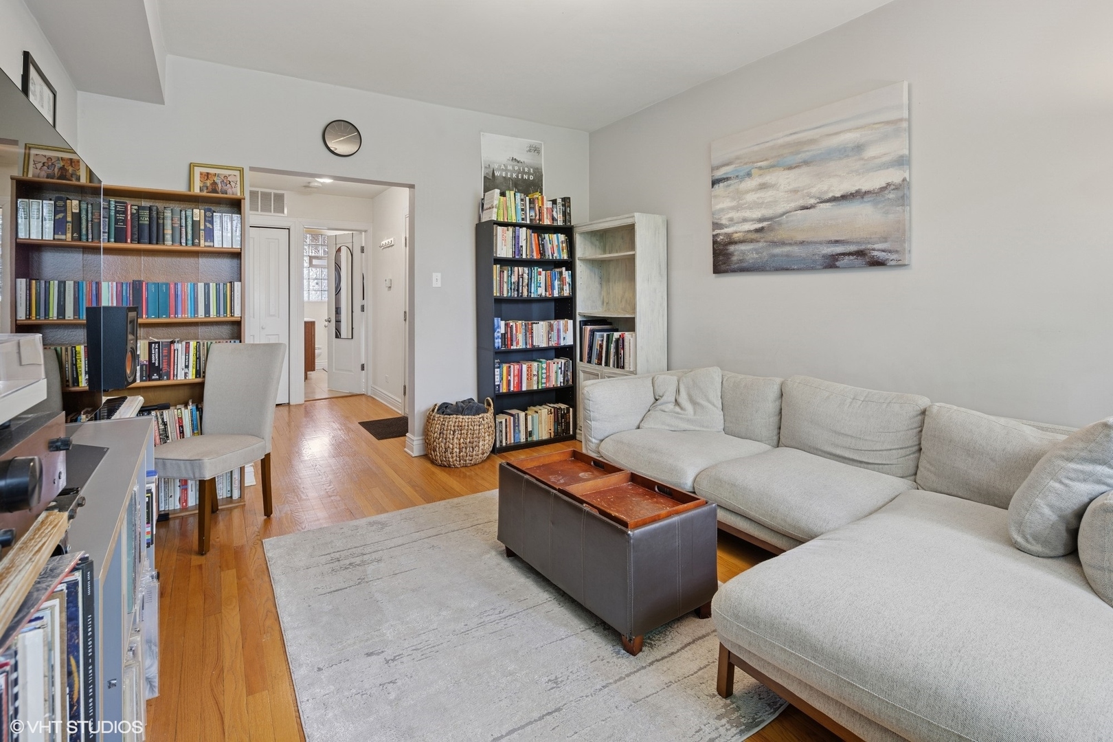 2709 West Altgeld Street, Unit 2 Chicago, IL 60647 - Photo 4 of 13 a living room with furniture and a book shelf