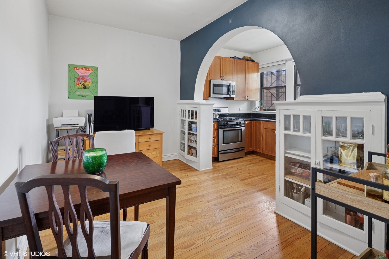 2709 West Altgeld Street, Unit 2 Chicago, IL 60647 - Photo 5 of 13 a view of a dining room with furniture window and wooden floor