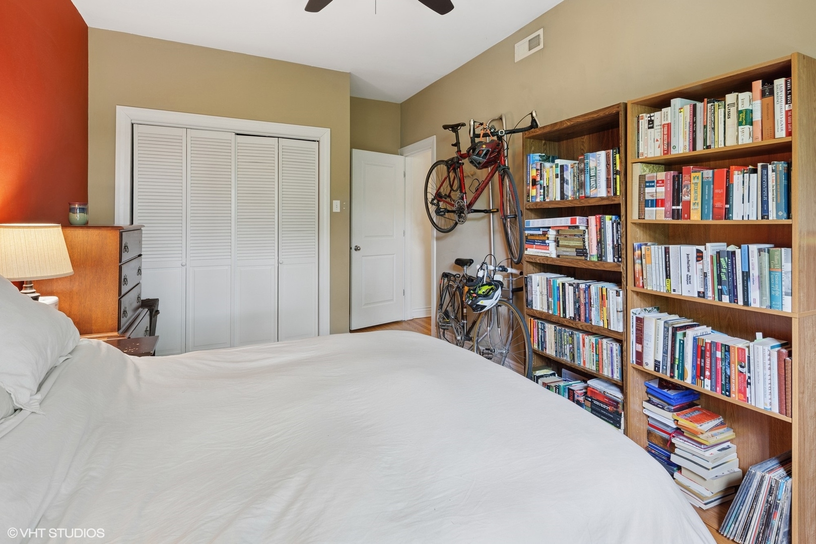 2709 West Altgeld Street, Unit 2 Chicago, IL 60647 - Photo 10 of 13 a bedroom with a bed and a book shelf