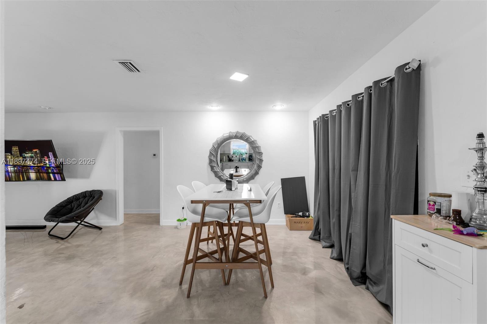 8811 Southwest 128th Street Miami, FL 33176 - Photo 14 of 28 a view of a workspace with furniture and a window