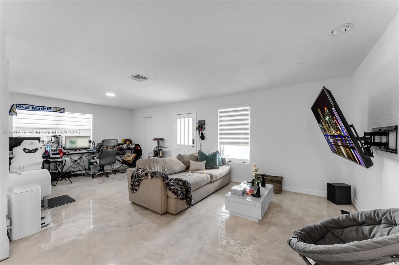 8811 Southwest 128th Street Miami, FL 33176 - Photo 15 of 28 a living room with furniture and a flat screen tv