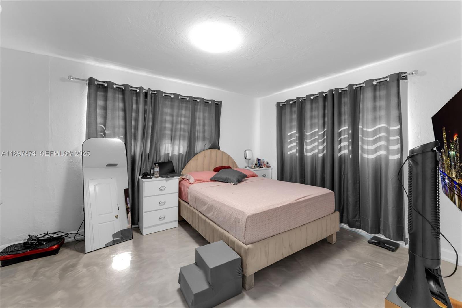 8811 Southwest 128th Street Miami, FL 33176 - Photo 17 of 28 a bedroom with a bed and a window