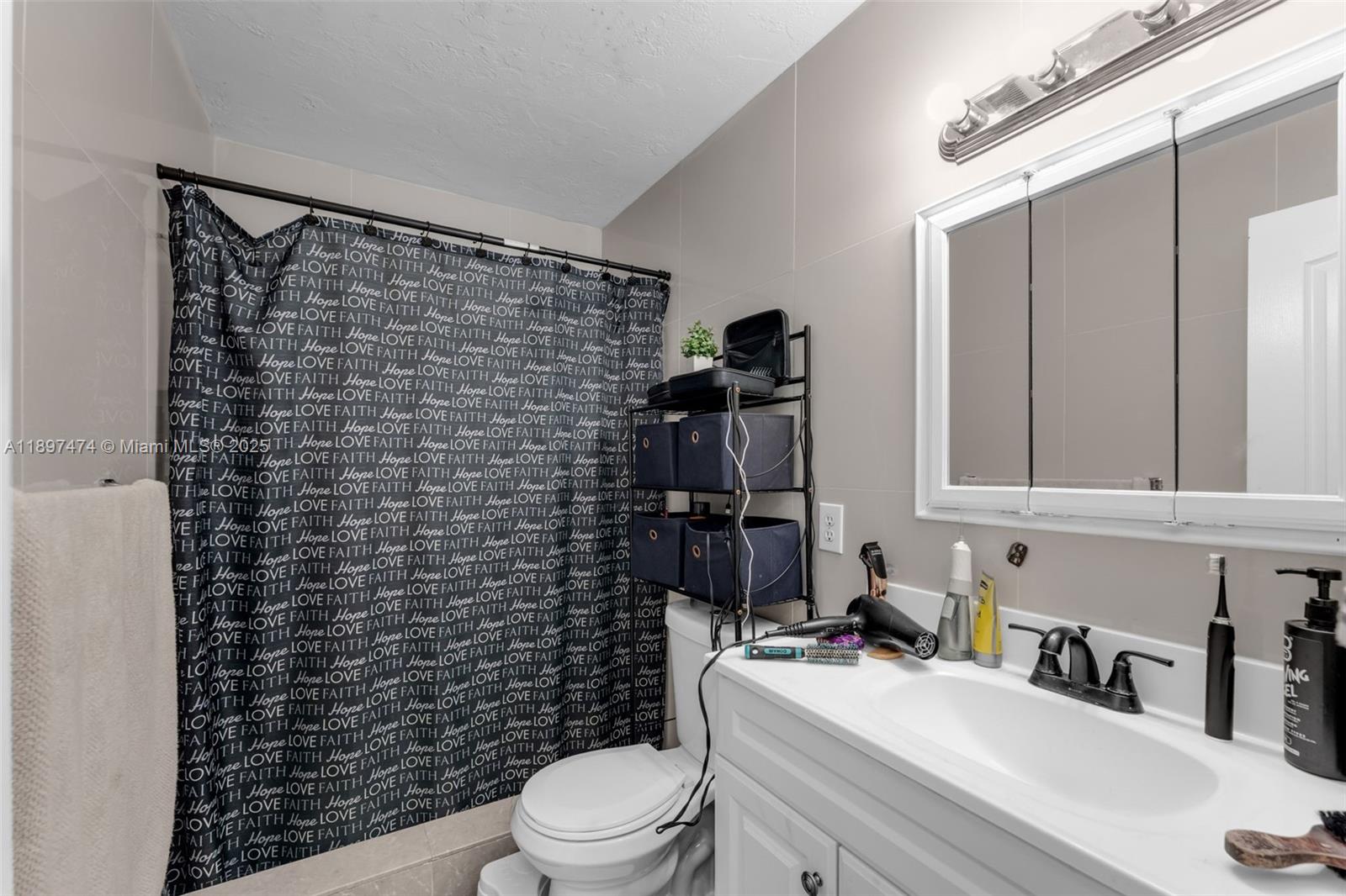 8811 Southwest 128th Street Miami, FL 33176 - Photo 22 of 28 a bathroom with a toilet a sink and shower