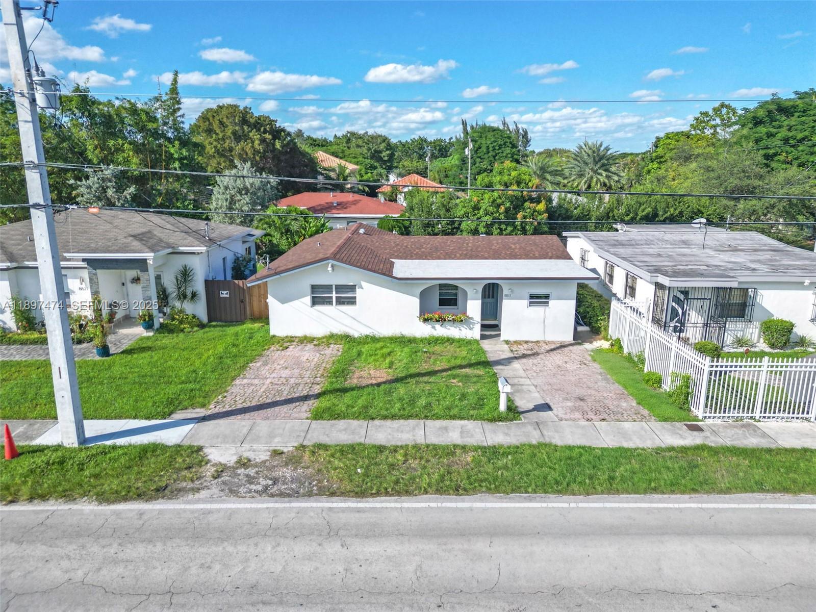 8811 Southwest 128th Street Miami, FL 33176 - Photo 3 of 28 a view of house with a yard