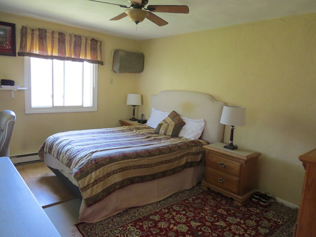 188 Swanson Road, Unit 336 Boxborough, MA 01719 - Photo 11 of 19 a bedroom with a bed and a window