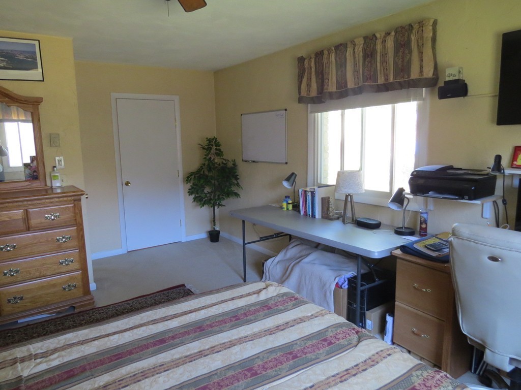 188 Swanson Road, Unit 336 Boxborough, MA 01719 - Photo 12 of 19 a spacious bedroom with a large bed and a desk