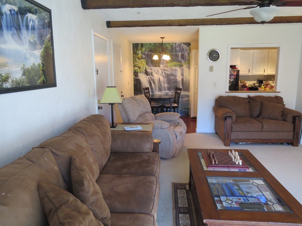 188 Swanson Road, Unit 336 Boxborough, MA 01719 - Photo 4 of 19 a living room with furniture and a painting on the wall