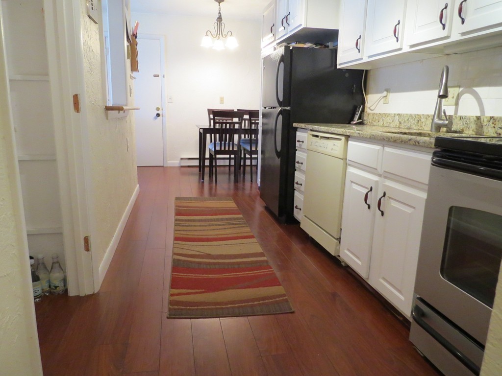 188 Swanson Road, Unit 336 Boxborough, MA 01719 - Photo 6 of 19 a kitchen with a sink appliances and cabinets