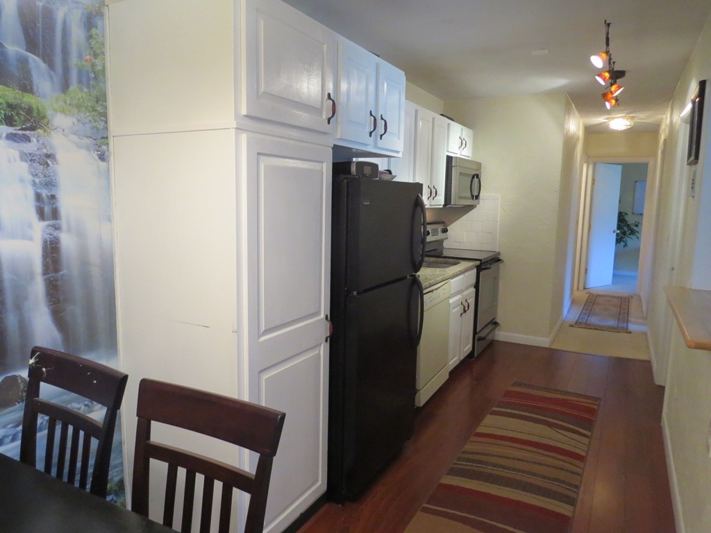 188 Swanson Road, Unit 336 Boxborough, MA 01719 - Photo 7 of 19 a kitchen with stainless steel appliances a refrigerator and a refrigerator