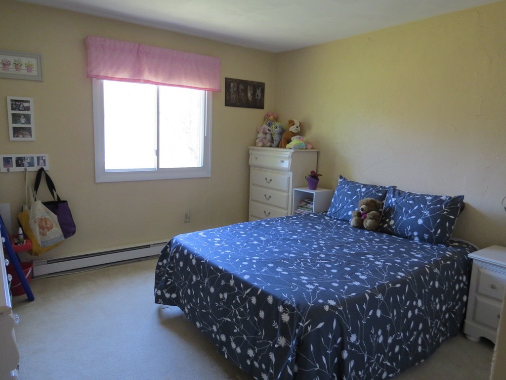188 Swanson Road, Unit 336 Boxborough, MA 01719 - Photo 9 of 19 a bedroom with a bed and window