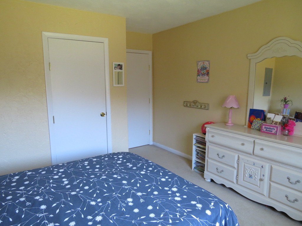 188 Swanson Road, Unit 336 Boxborough, MA 01719 - Photo 10 of 19 a bedroom with a bed and a dresser in it