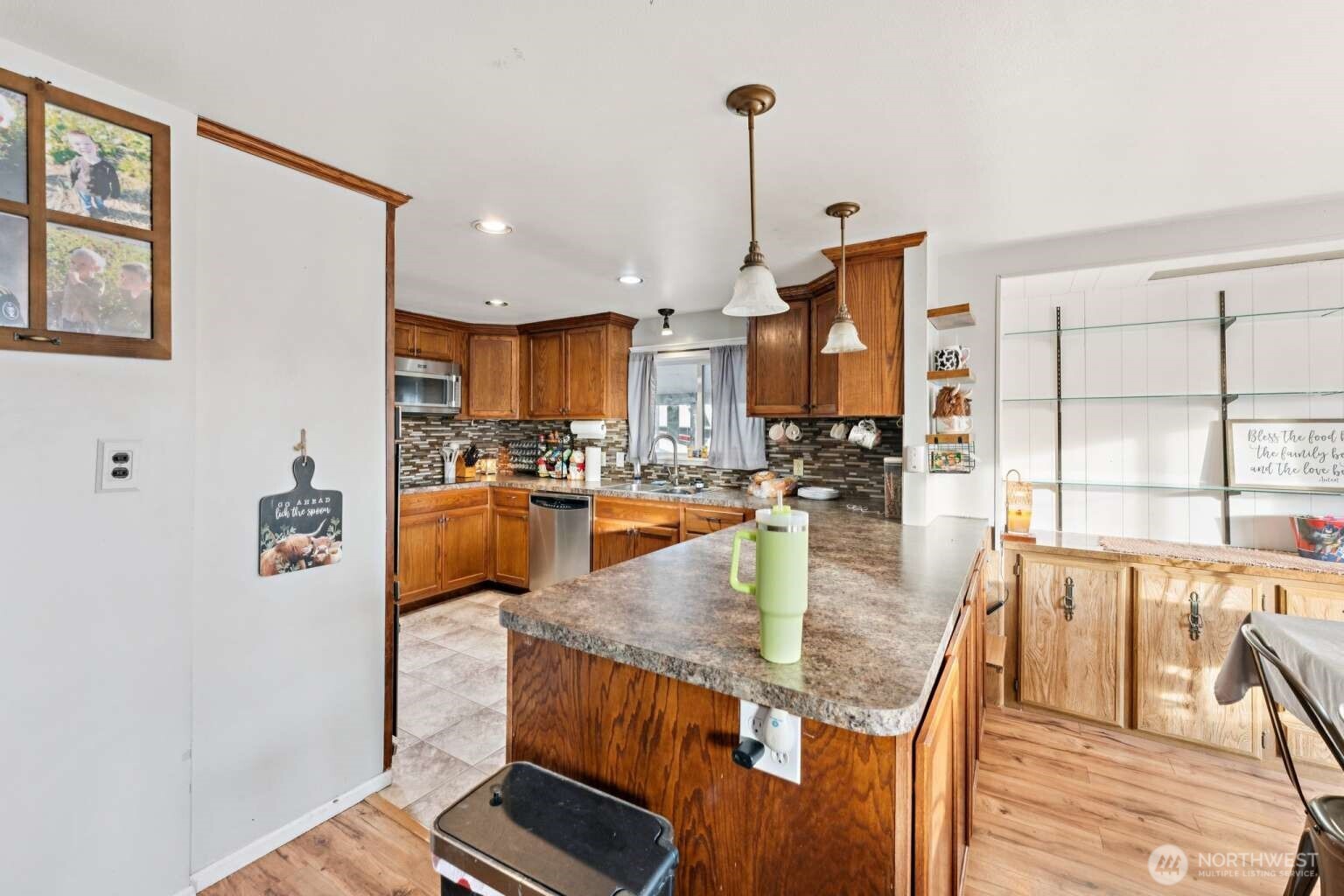 10068 Idano Road Northeast Moses Lake, WA 98837 - Photo 17 of 40 a kitchen with stainless steel appliances granite countertop sink stove and refrigerator