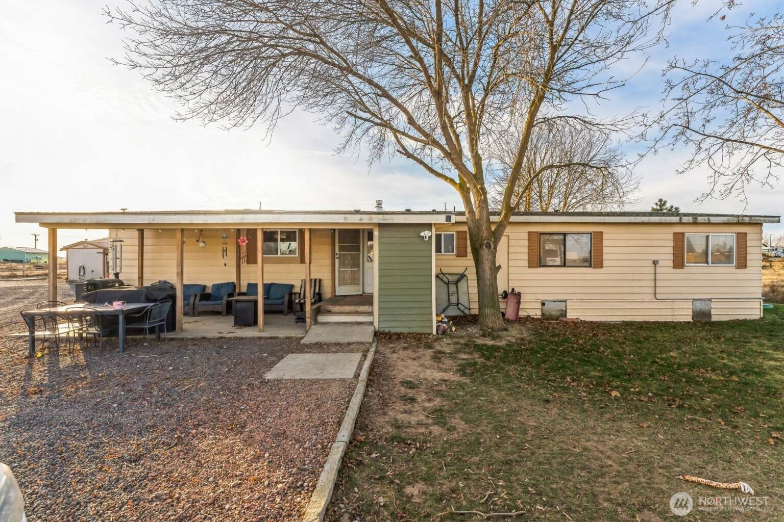 10068 Idano Road Northeast Moses Lake, WA 98837 - Photo 2 of 40 a view of a house with a patio