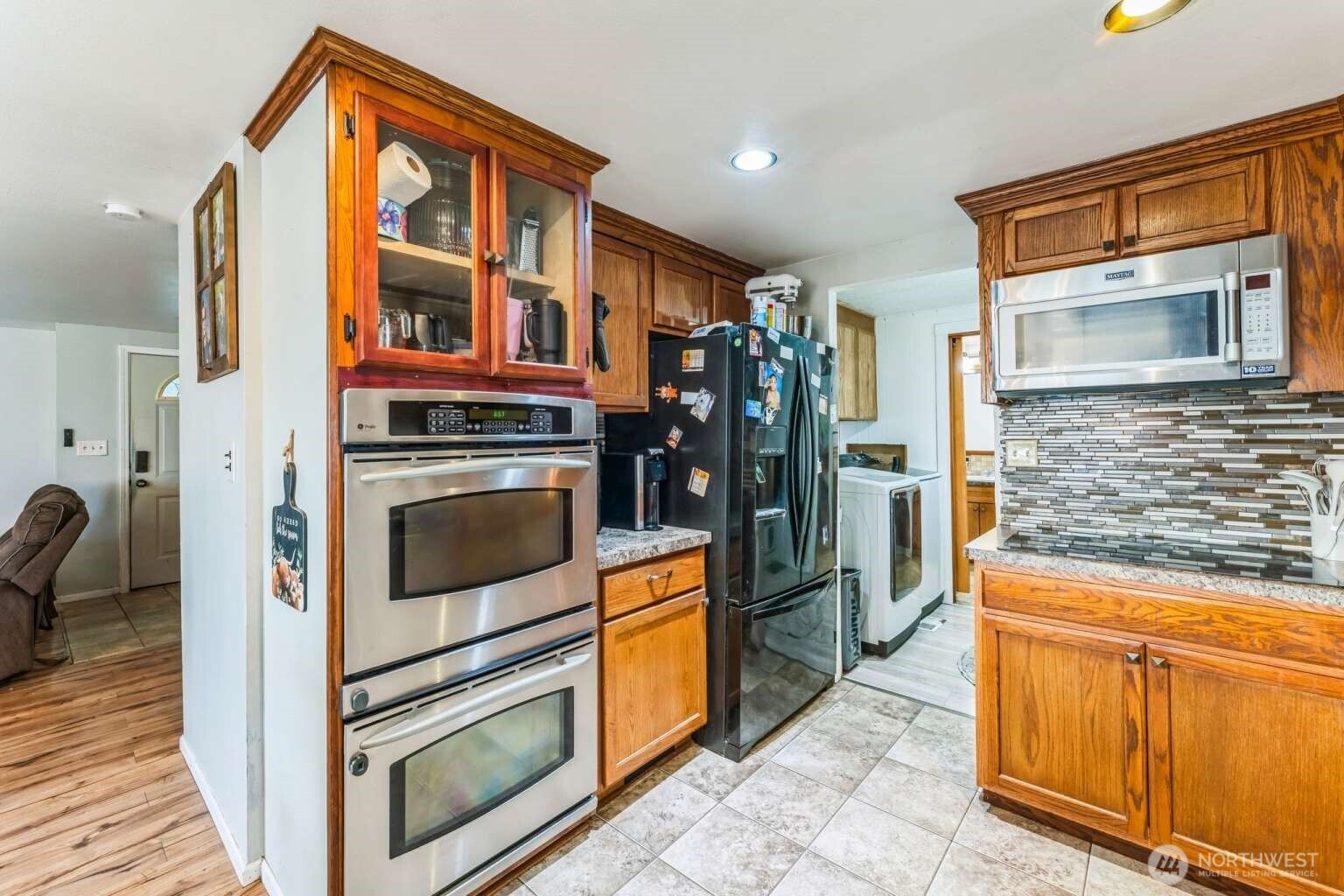 10068 Idano Road Northeast Moses Lake, WA 98837 - Photo 21 of 40 a kitchen with stainless steel appliances granite countertop a stove and a refrigerator