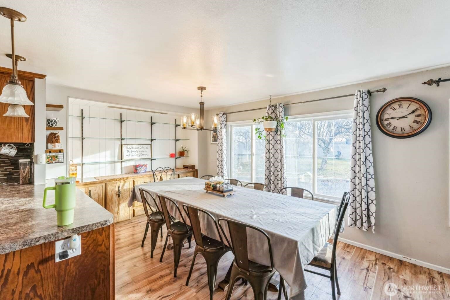 10068 Idano Road Northeast Moses Lake, WA 98837 - Photo 23 of 40 a view of a dining room with furniture window and outside view