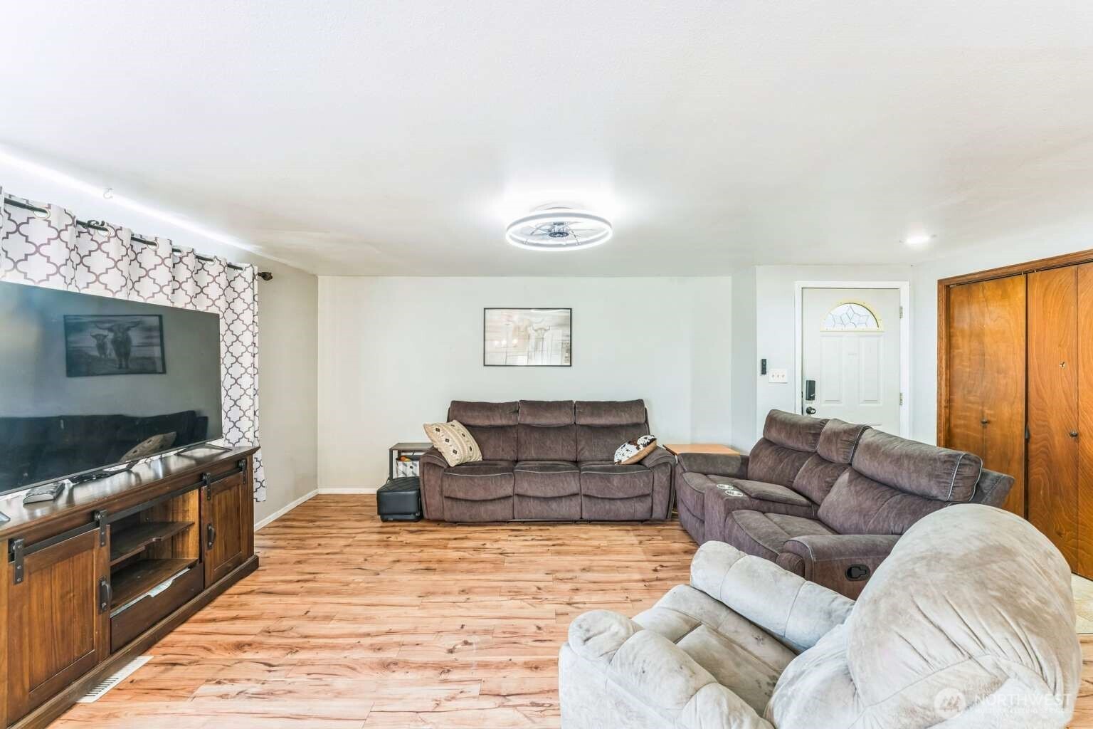 10068 Idano Road Northeast Moses Lake, WA 98837 - Photo 10 of 40 a living room with furniture and a flat screen tv