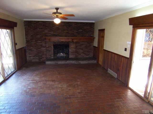 1402 Brooks Avenue Raleigh, NC 27608 - Photo 7 of 12 a view of a livingroom with a fireplace
