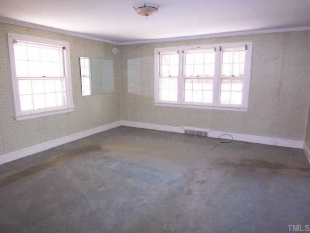 1402 Brooks Avenue Raleigh, NC 27608 - Photo 9 of 12 an empty room with a window