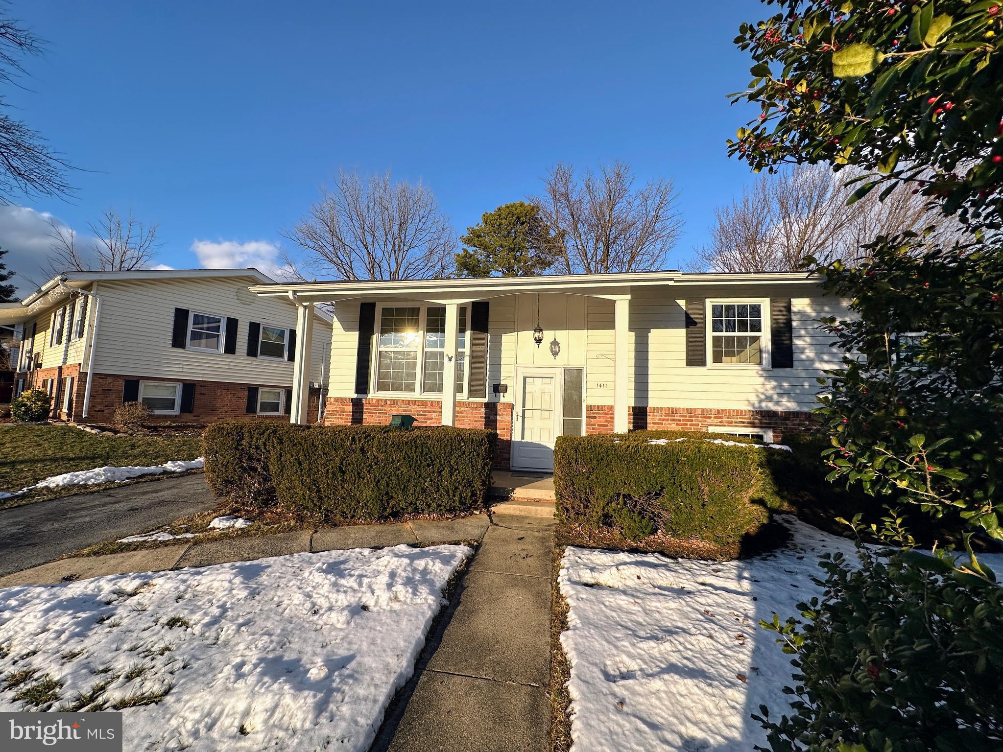 1411 West 12th Street Frederick, MD 21702 - Photo 1 of 16 a front view of a house with a yard