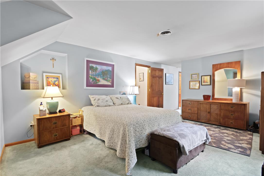 209 Remington Road East Stroudsburg, PA 18301 - Photo 23 of 41 Relax in this tranquil bedroom, featuring soft carpet flooring and subtle wall art.