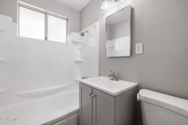 a bathroom with a sink and a vanity