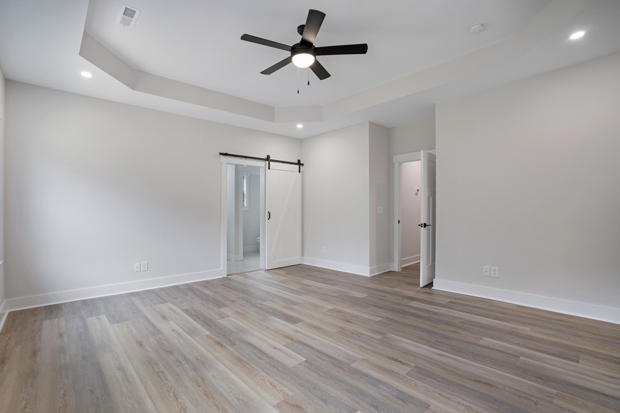2615 Cooper Creek Road Woodlawn, TN 37191 - Photo 19 of 30 a view of a room with wooden floor and a ceiling fan