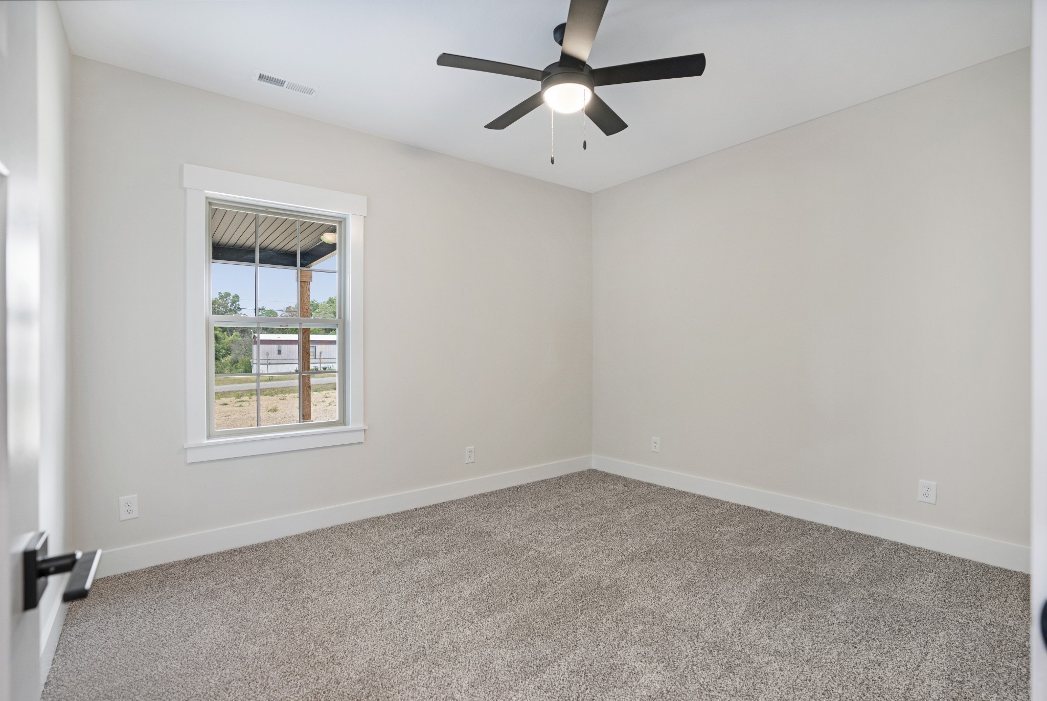 2615 Cooper Creek Road Woodlawn, TN 37191 - Photo 23 of 30 an empty room with a window and a fan