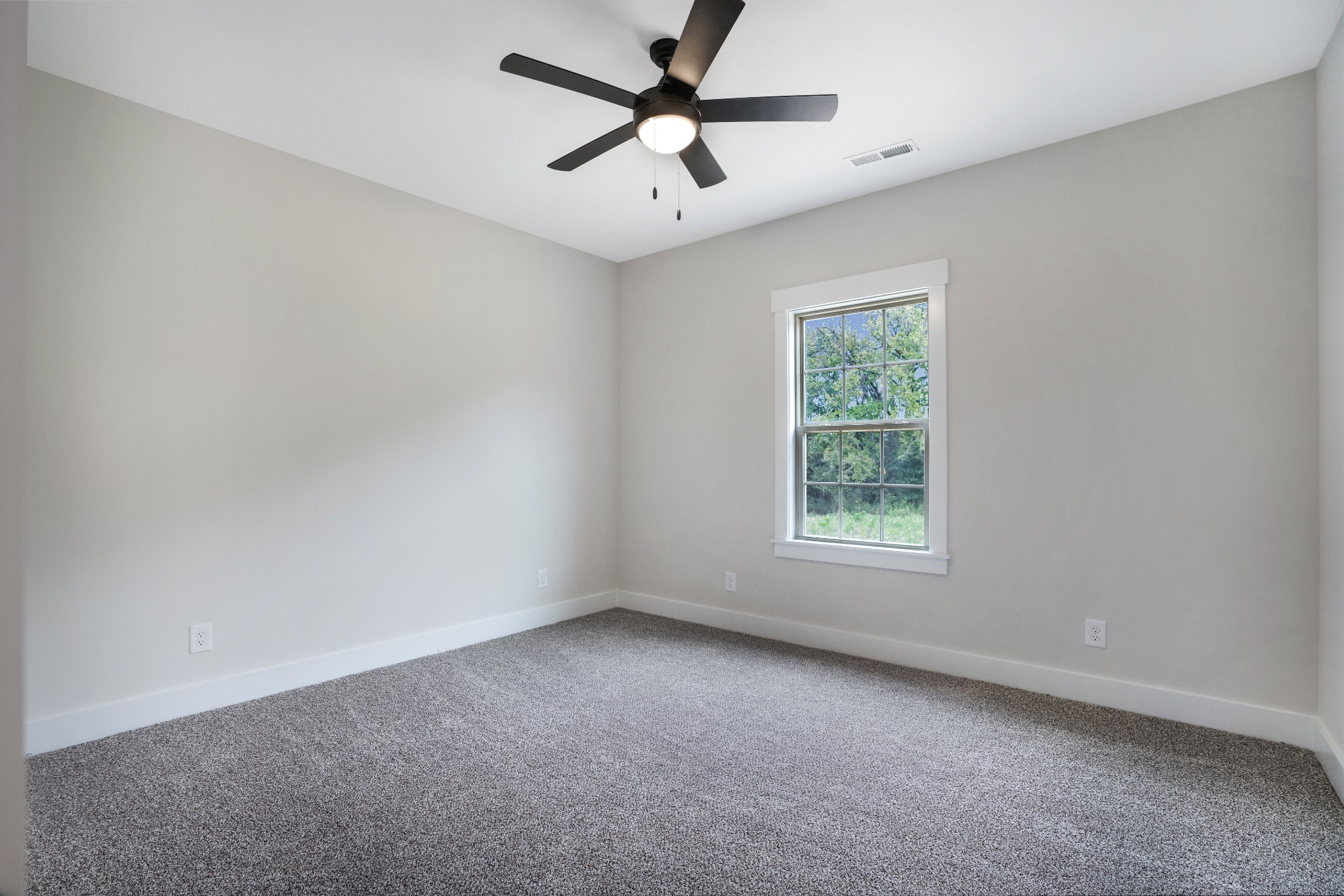 2615 Cooper Creek Road Woodlawn, TN 37191 - Photo 25 of 30 an empty room with a window and a fan