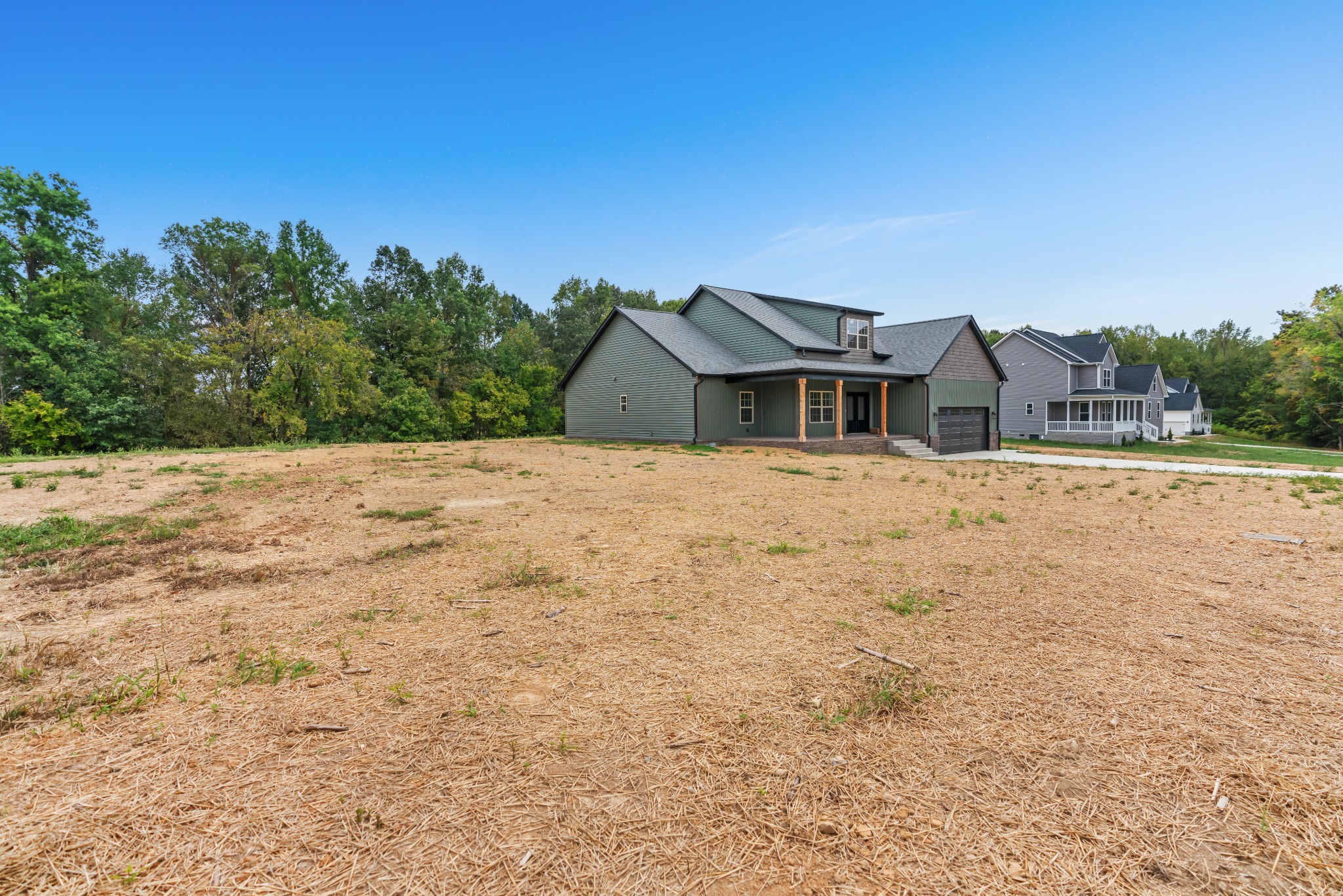 2615 Cooper Creek Road Woodlawn, TN 37191 - Photo 4 of 30 a front view of a house with a yard