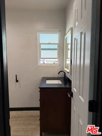 a white toilet sitting next to a bathroom sink