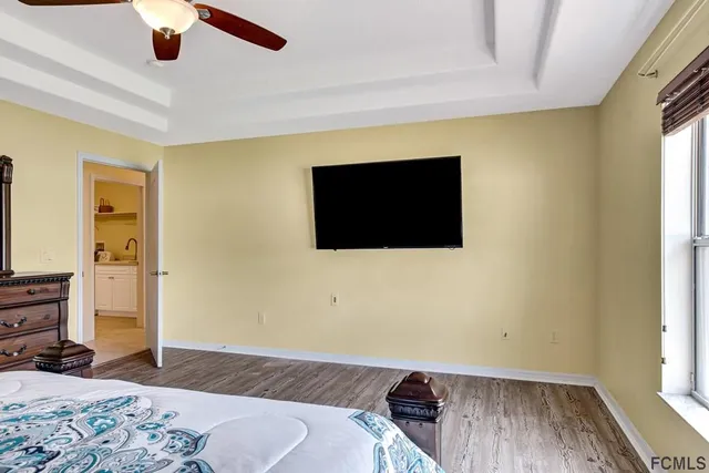 a large bathroom with a double vanity sink toilet and shower