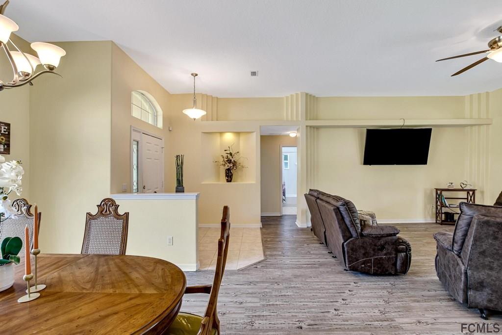 102 Ulysses Trail Palm Coast, FL 32164 - Photo 40 of 62 a view of a dining room with furniture