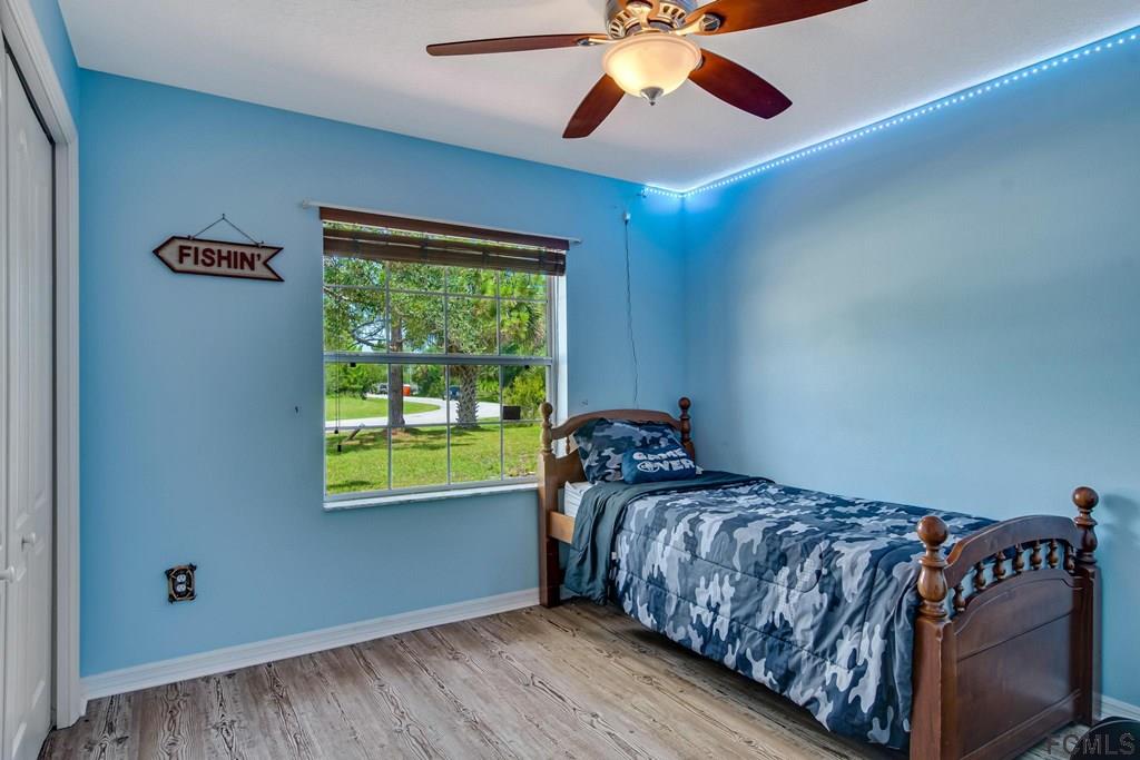 102 Ulysses Trail Palm Coast, FL 32164 - Photo 42 of 62 a bedroom with a bed and a window