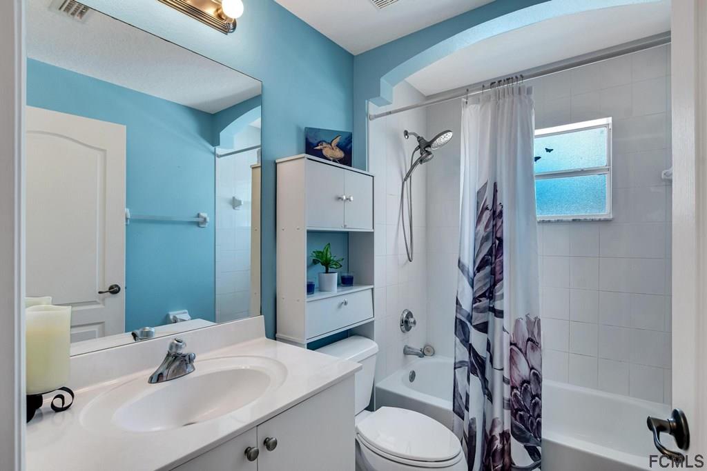 102 Ulysses Trail Palm Coast, FL 32164 - Photo 47 of 62 a bathroom with a sink toilet and shower