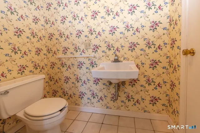 a bathroom with a toilet and a sink