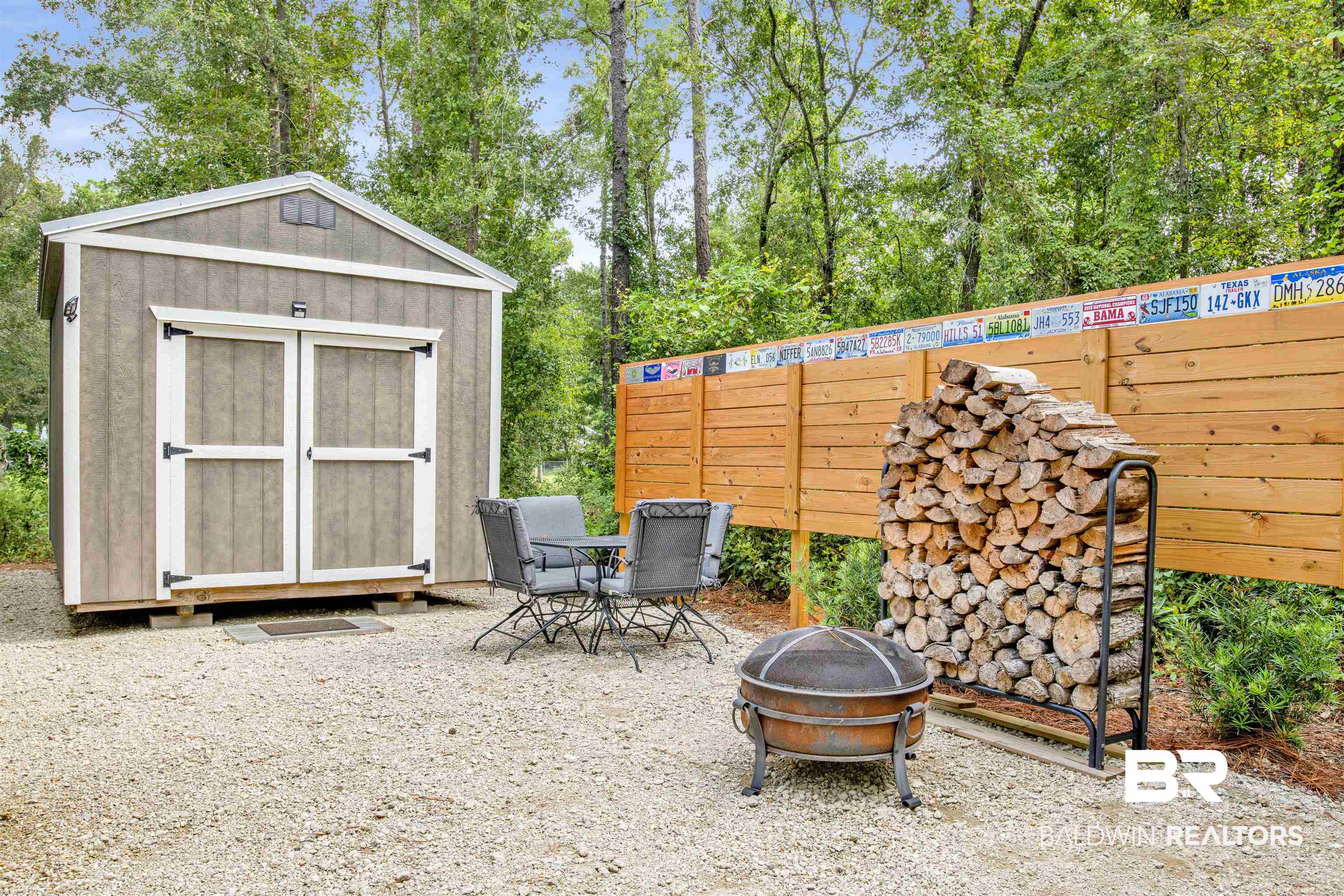 6874 Cook Road Foley, AL 36535 - Photo 7 of 24 View of patio with a fire pit and a storage unit