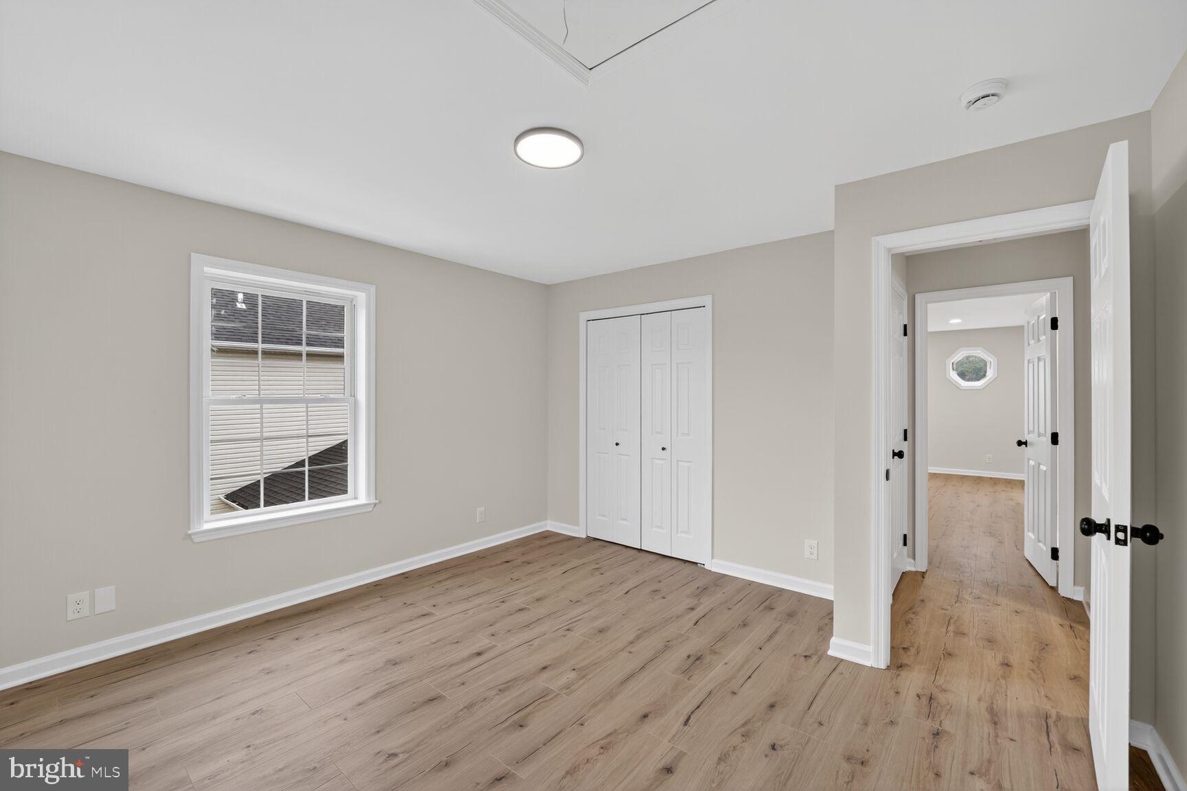 1992 Retta Gilliam Court Southeast Washington, DC 20020 - Photo 17 of 29 wooden floor in an empty room with a window
