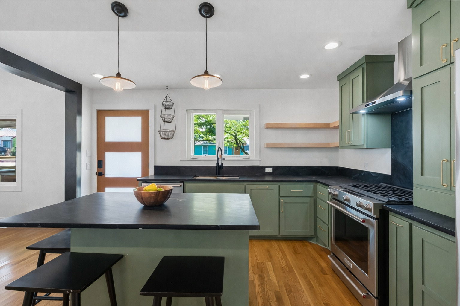 5409 Avenue H Austin, TX 78751 - Photo 13 of 35 a kitchen with a table chairs a sink dishwasher window and cabinets