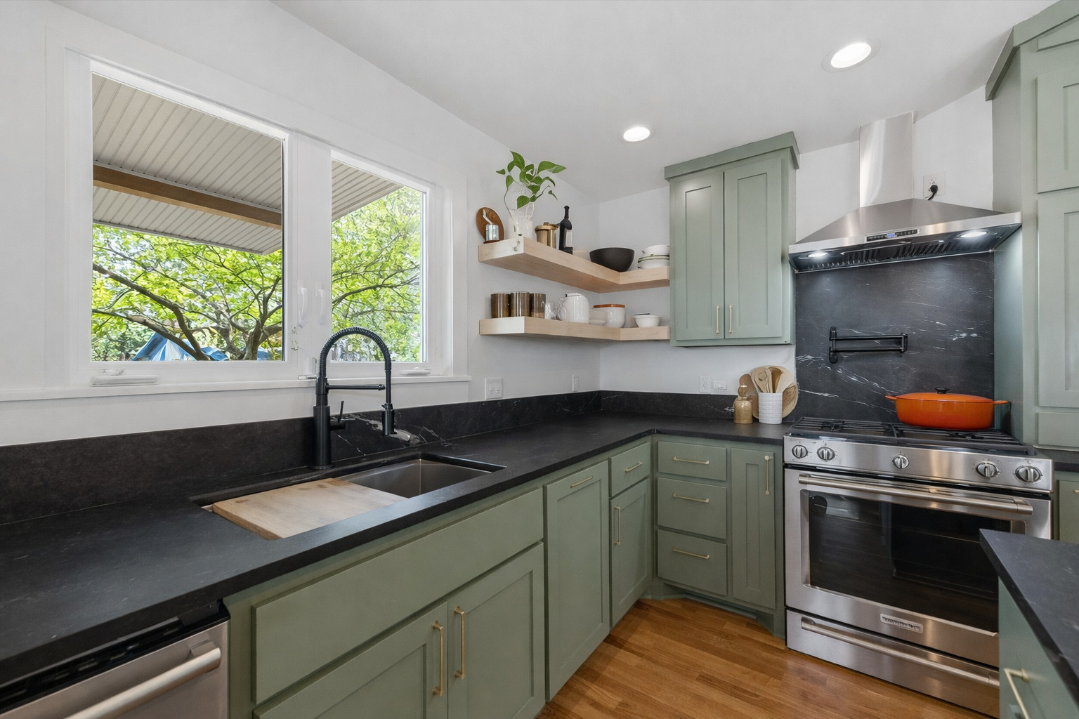 5409 Avenue H Austin, TX 78751 - Photo 14 of 35 a kitchen with stainless steel appliances a sink stove and cabinets