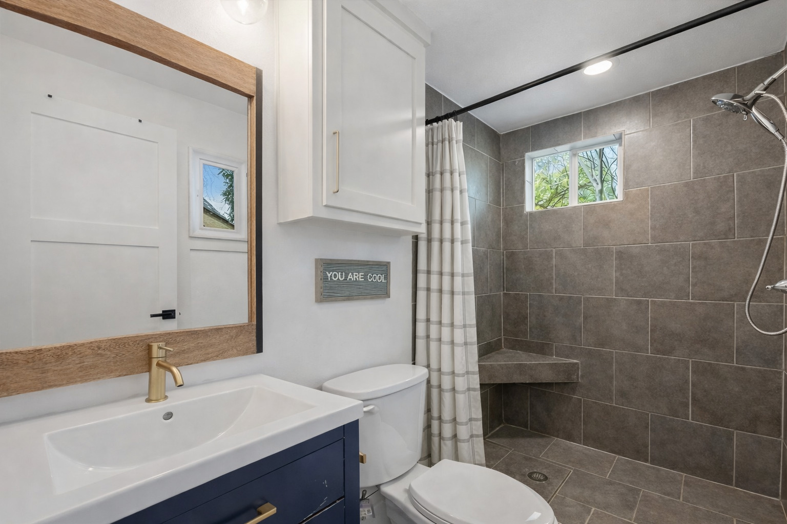 5409 Avenue H Austin, TX 78751 - Photo 18 of 35 a bathroom with a sink a toilet and shower