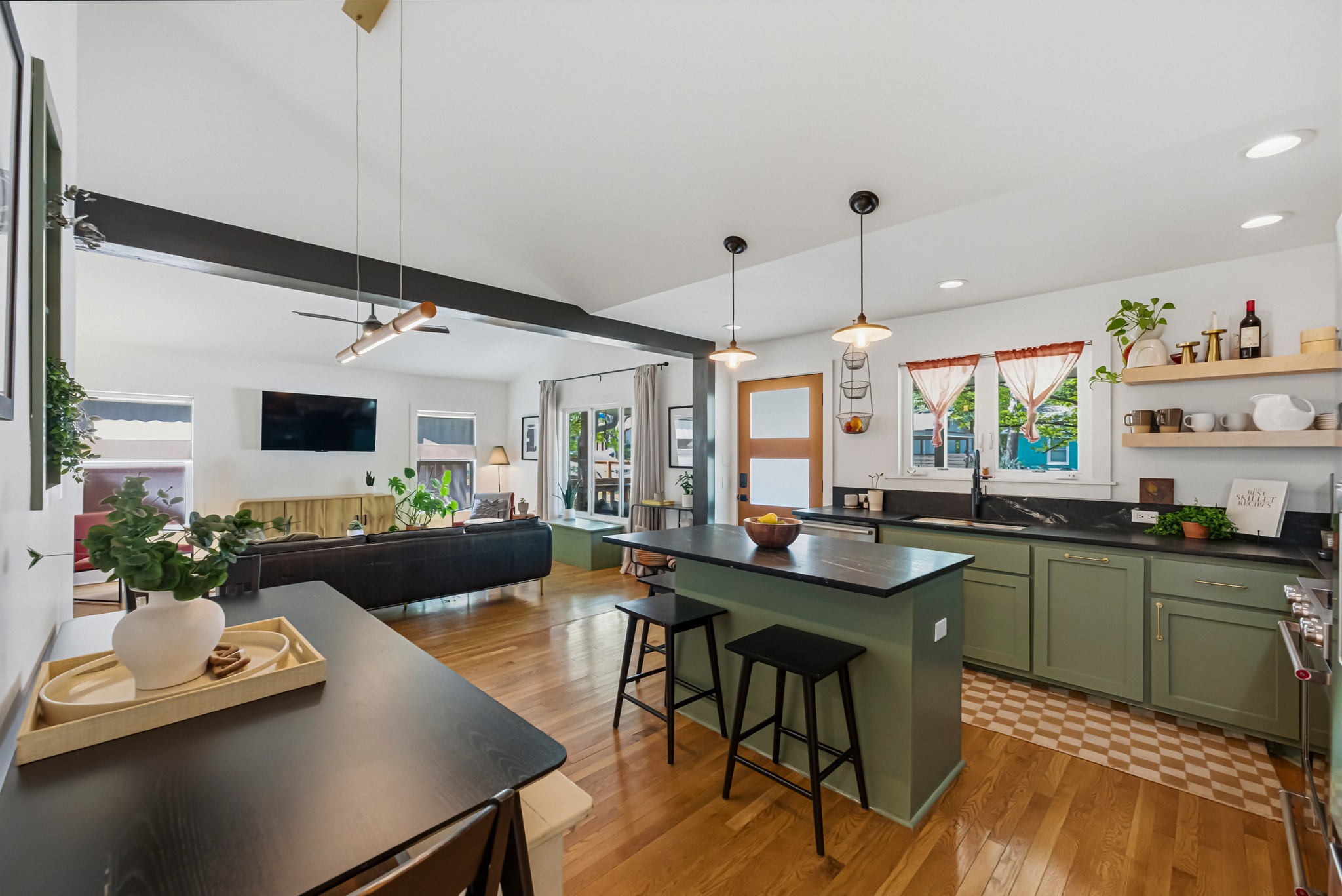 5409 Avenue H Austin, TX 78751 - Photo 8 of 35 a kitchen with a table chairs and flat screen tv
