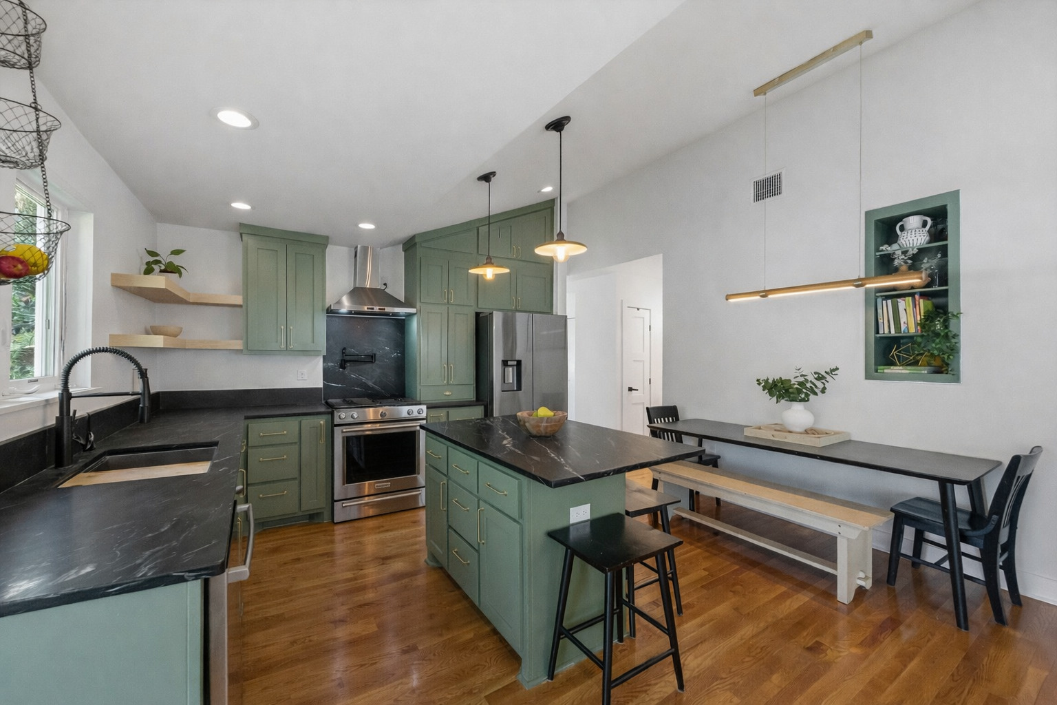 5409 Avenue H Austin, TX 78751 - Photo 9 of 35 a kitchen with stainless steel appliances granite countertop sink stove top oven and cabinets