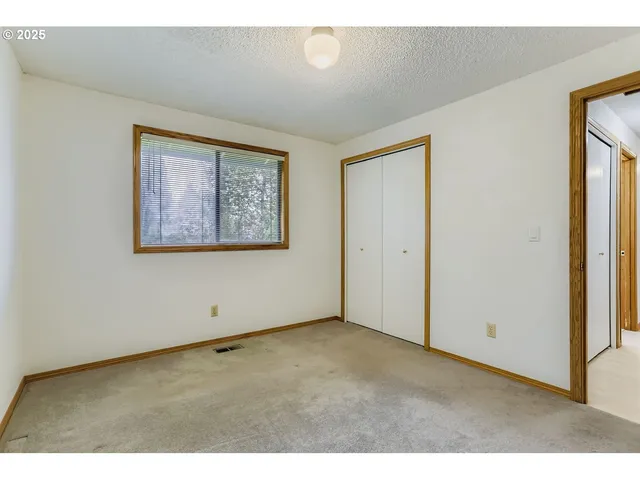 a bathroom with a sink mirror and toilet