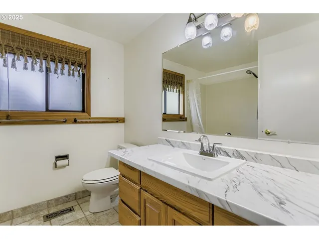 a utility room with a sink washer and dryer