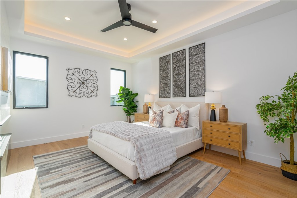2101 Rockefeller Lane Redondo Beach, CA 90278 - Photo 21 of 45 a living room with a bed furniture and a window